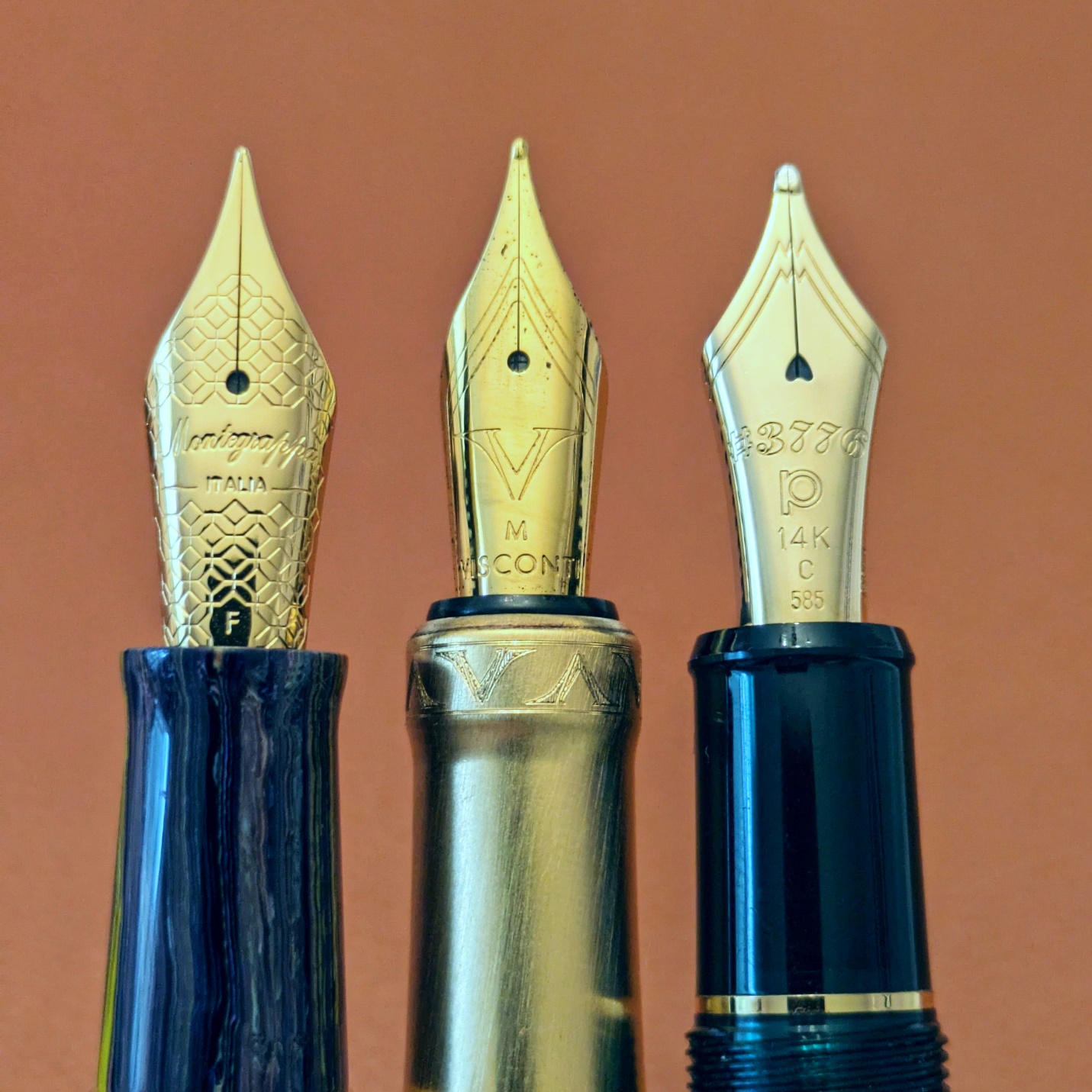 Left to right: Montegrappa Venetia, Visconti Opera Gold, Platinum 3776. The V logo honestly looks more suited to the wide shoulders of the 3776 nib.