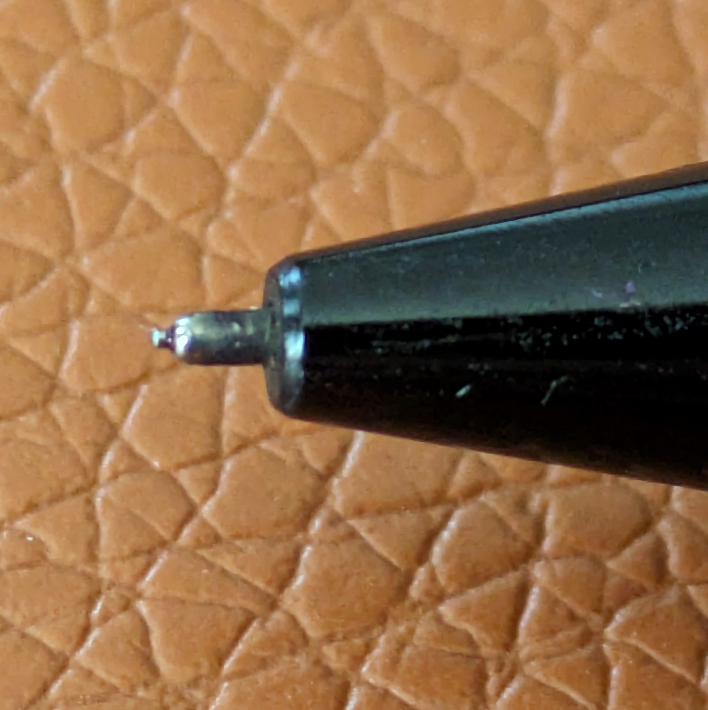 The tiny needle protruding from the end of the tube on the Cygnet.